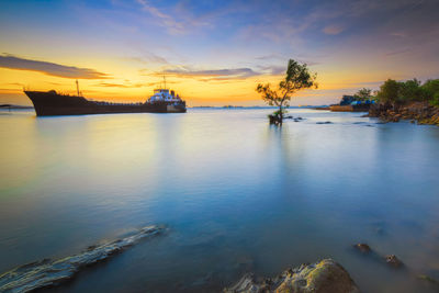 Scenic view of sea against sky during sunset