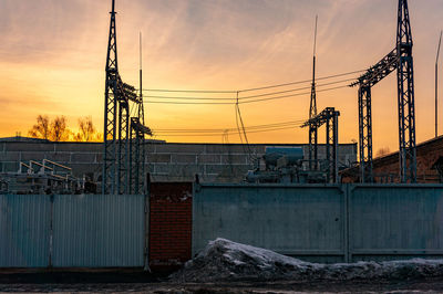 Electric substation in the rays of the setting sun