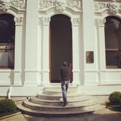 Low angle view of woman walking in corridor