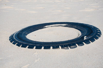 High angle view of tire on sand
