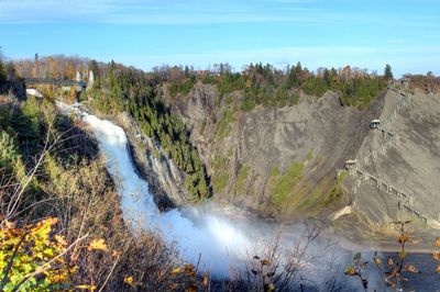 Scenic view of montmorency falls against sky