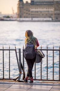 Full length of woman standing in water