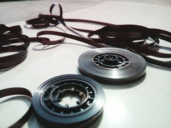 Close-up of reels on table