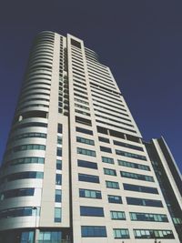 Low angle view of skyscraper against clear sky