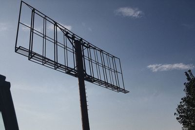 Low angle view of silhouette built structure against sky