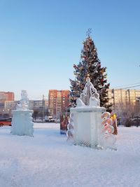 Christmas tree and ice sculptures on 9 may street in winter krasnoyarsk.