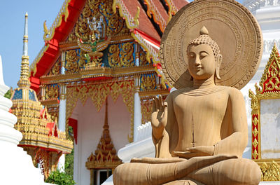 Closeup of a gorgeous seated buddha image at wat chomphuwek historic buddhist temple, thailand