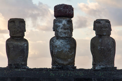 Statue of historic building moai against sky