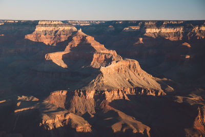 Scenic view of eroded landscape against clear sky