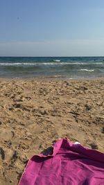 Close-up of beach against sky