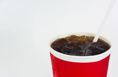 Close-up of coffee cup against white background