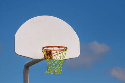 Low angle view of basketball hoop against sky