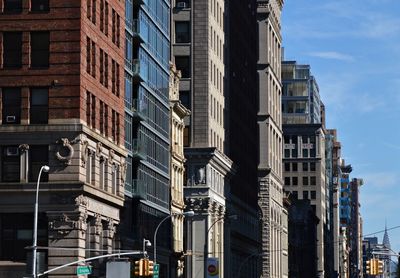 Low angle view of buildings in city against sky