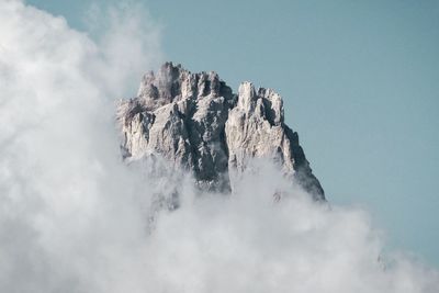 Low angle view of rock formation against sky