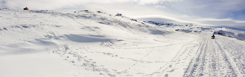 Scenic view of snow covered mountains