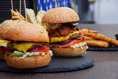 Close-up of burgers on table
