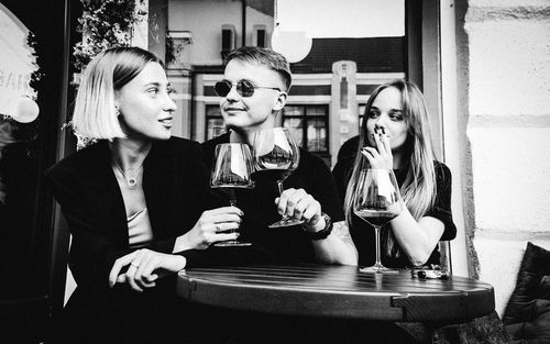 Group of people in glass on table