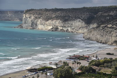 Scenic view of beach by sea against sky