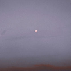 Low angle view of moon against sky at night