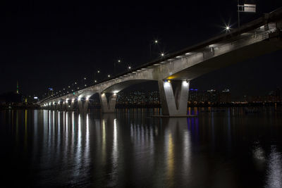 Low angle view of wonhyo bridge over han river in city against sky at night