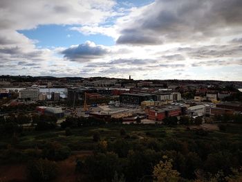 Houses in town against sky