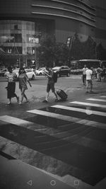 People on road in city