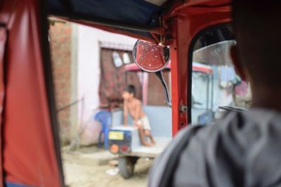 Close-up of man driving vehicle