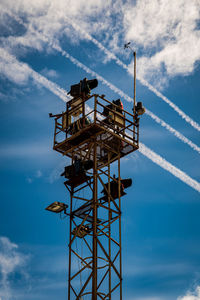 Low angle view of communications tower against sky