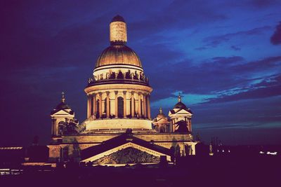 Low angle view of illuminated cathedral against sky at night