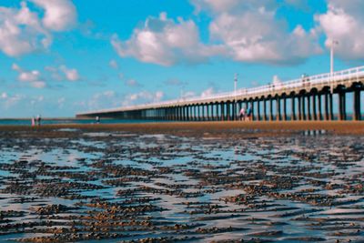 Bridge over sea against sky