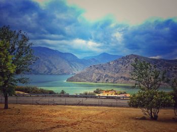 Scenic view of mountains against cloudy sky