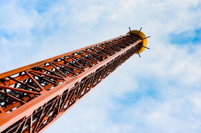 Low angle view of crane against sky