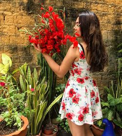 Woman with red flowers