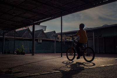 Man riding bicycle in city