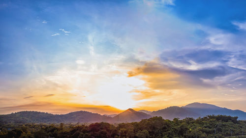 Scenic view of mountains against sky during sunset