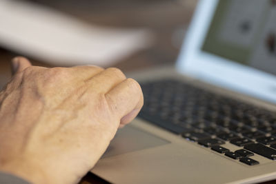 Close-up of hand using mobile phone