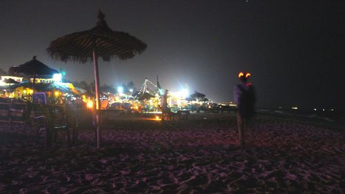 Man on illuminated city at night