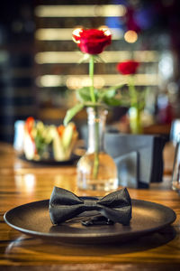 Bow tie on the plate on table in restaurant