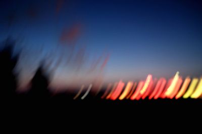 Silhouette of trees against sky at sunset