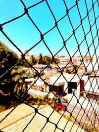 Full frame shot of chainlink fence against sky