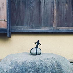 Bicycle on wall against building