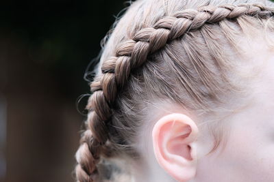 Cropped image of girl with braided hair