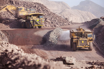 Loading of copper ore on very big dump-body truck