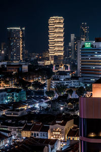 Illuminated buildings in city at night