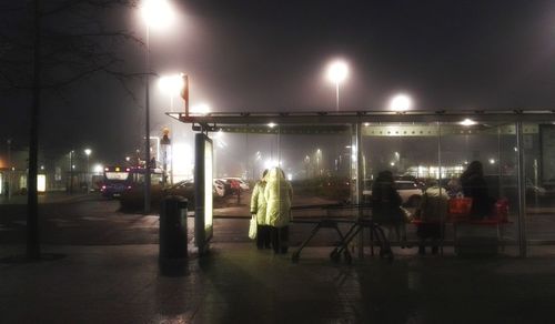 Illuminated street light in city at night