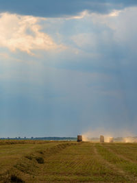 Scenic view of field against sky during sunset