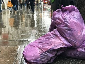 Close-up of wet purple umbrella in rainy season