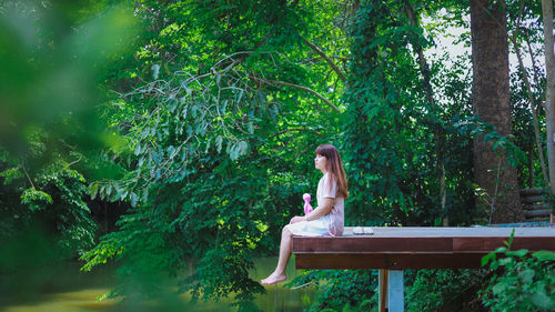 Woman sitting in a forest