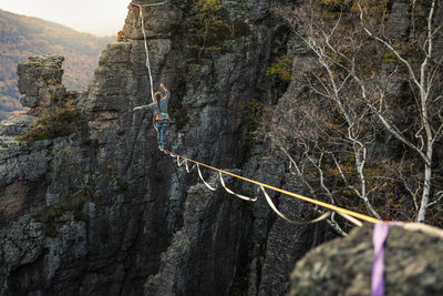 Woman balancing while highlining at baden-baden, germany