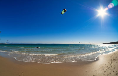 Scenic view of beach against clear sky